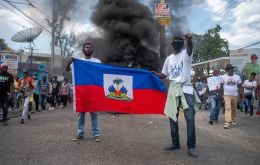 Six police officers and five members of the Canapé-Vert vigilante group also died