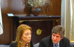 <br />
<br />
<br />
Acting president Boudou (R) and Minister Giogi<br />
