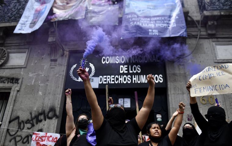 The activists defaced office signs with hammers, pinned up banners and painted slogans on walls angry with what they decry as insufficient government action to root out the crimes